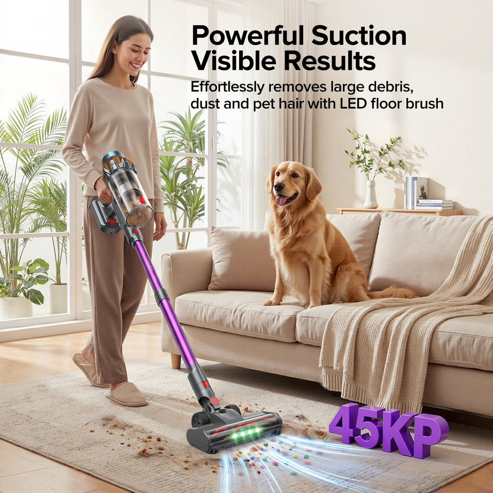 A woman vacuums a living room rug with a cordless stick vacuum while a golden retriever sits on a beige sofa nearby. Text on the image highlights powerful suction and visible results, with a 45KP marking in the corner.