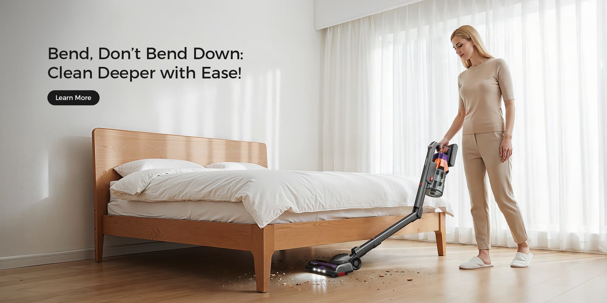 Woman using a vacuum cleaner to clean under a bed in a bedroom.
