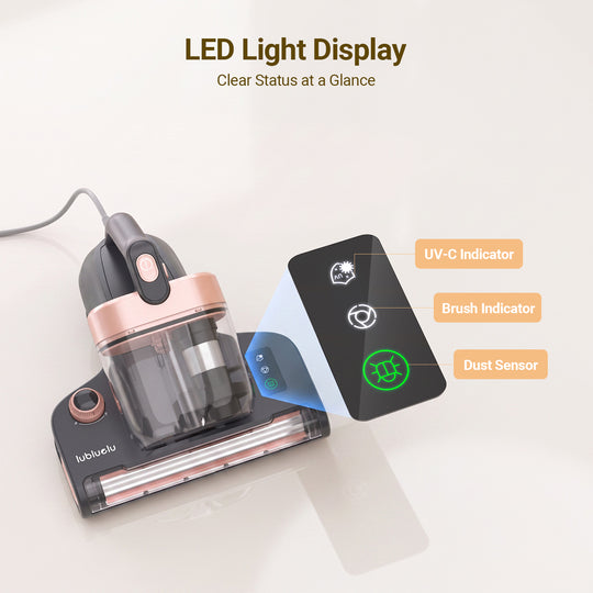 A handheld vacuum cleaner in black and rose gold with a transparent dust bin, shown on a light beige background with an inset diagram highlighting its LED light display indicators: UV-C indicator, brush indicator, and dust sensor.