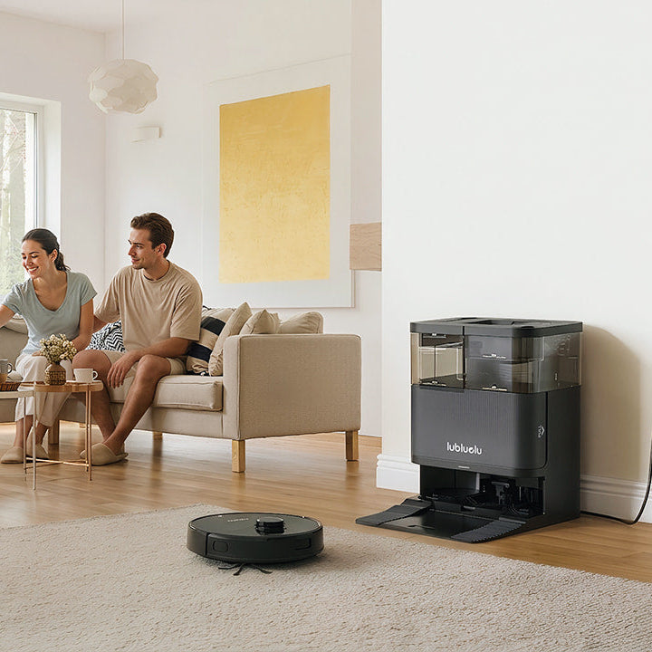 Family with a dog in a living room with a robot vacuum cleaner